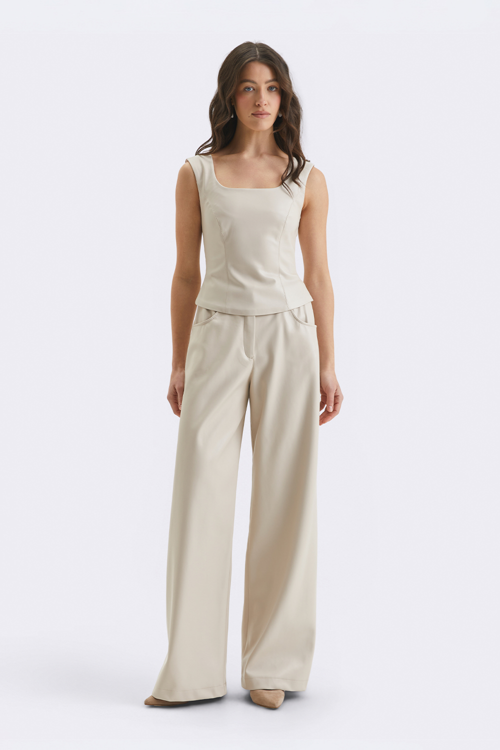 Кремові штани з екошкіри