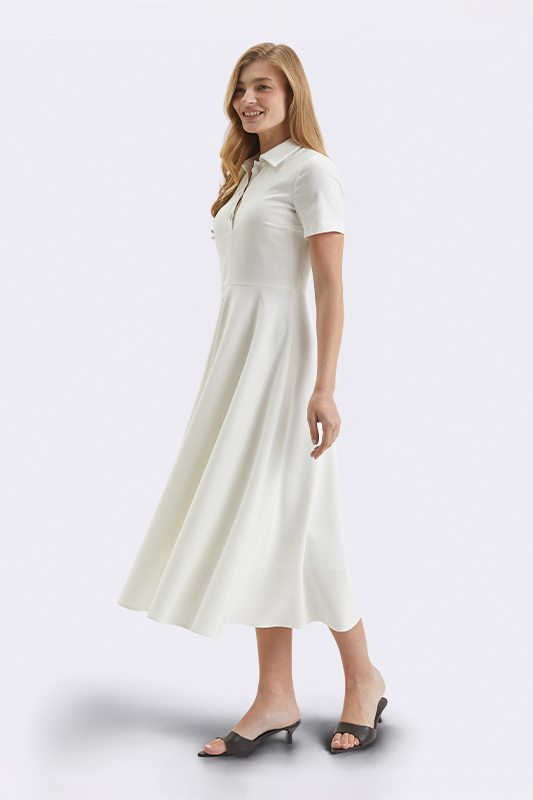 Елегантна біла сукня міді довжини від Natali Bolgar