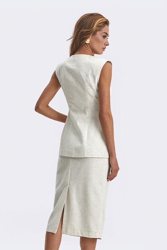 An elegant Natali Bolgar women's top and midi skirt in pastel beige – a perfect look for spring and summer.