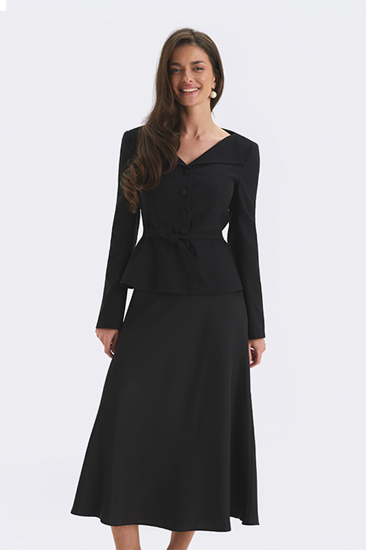 Elegant Natali Bolgar women's look: black V-neck jacket and midi skirt for a business style.