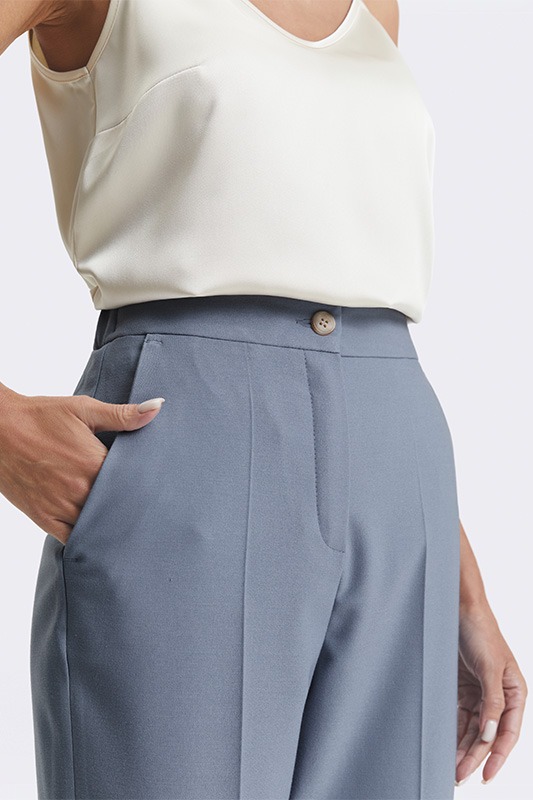 Blue women's trousers, a detail from an elegant Natali Bolgar look with a cream top and high waist for comfort.