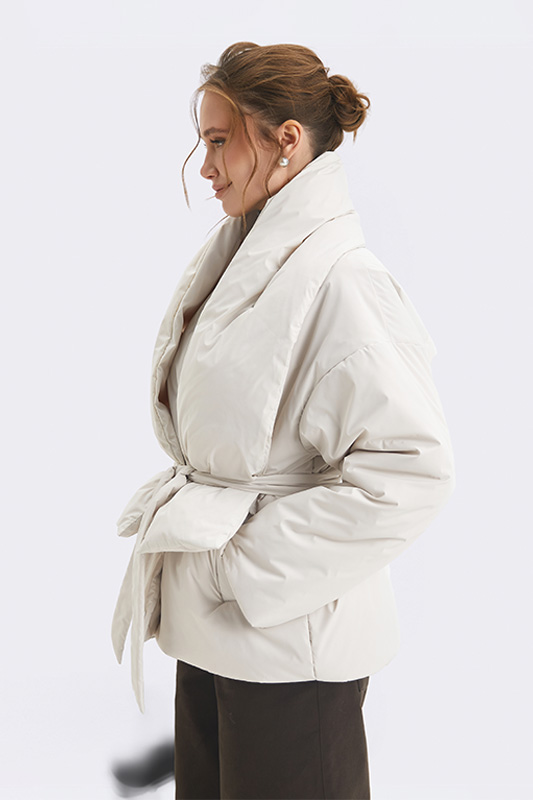 A stylish light beige down jacket from Natali Bolgar with a wide collar and a belt. Ideal outerwear for the autumn-spring season.