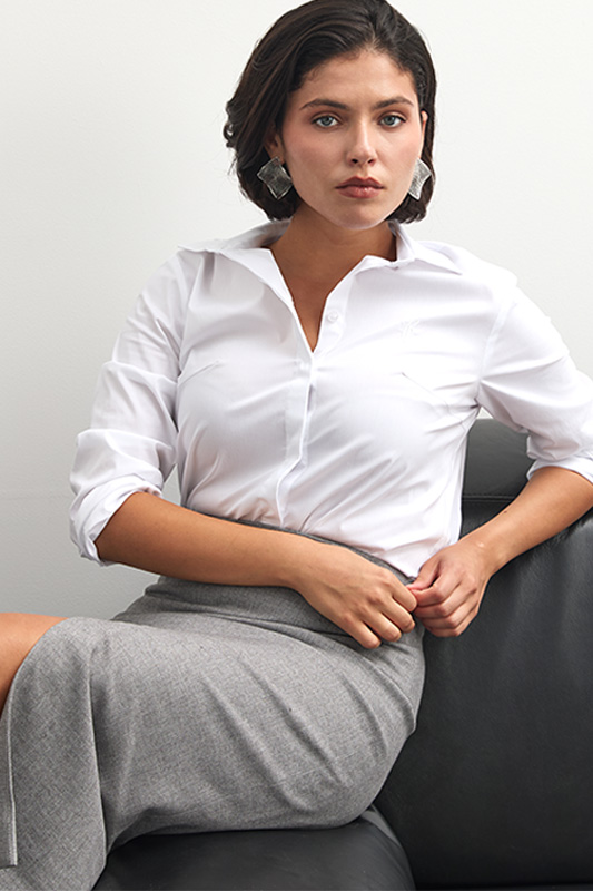 A classic look from Natali Bolgar: a white shirt and a grey midi skirt for the office or a business meeting.